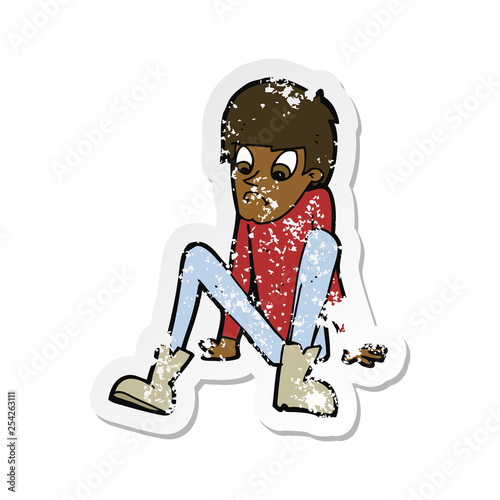 retro distressed sticker of a cartoon boy sitting on floor