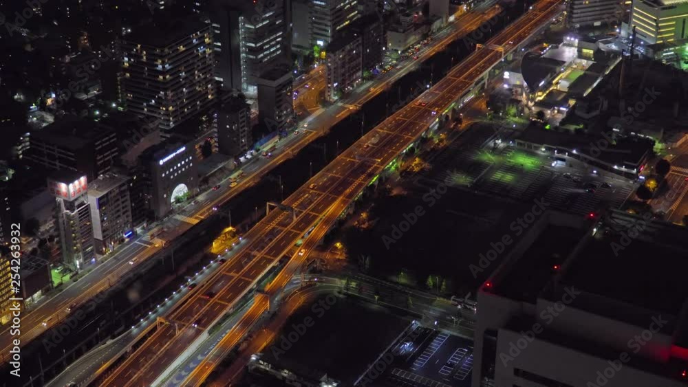 Aerial dolly shot of night traffic and city lights in Tokyo, Japan Aerial dolly shot of night traffic and city lights in Tokyo, Japan