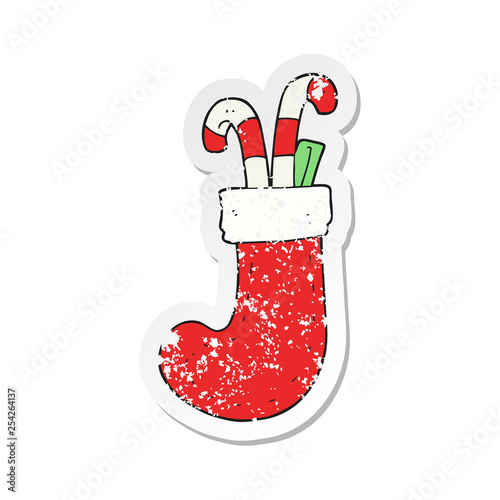 retro distressed sticker of a cartoon christmas stocking