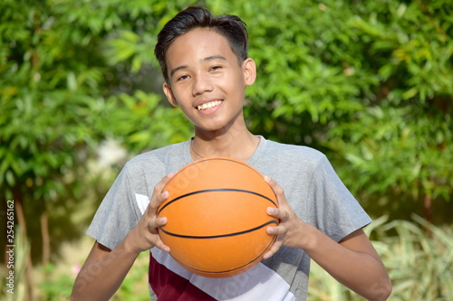 Happy Male Basketball Player With Basketball