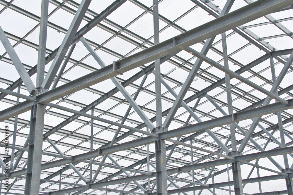Structure of steel for building construction on sky background at the construction site