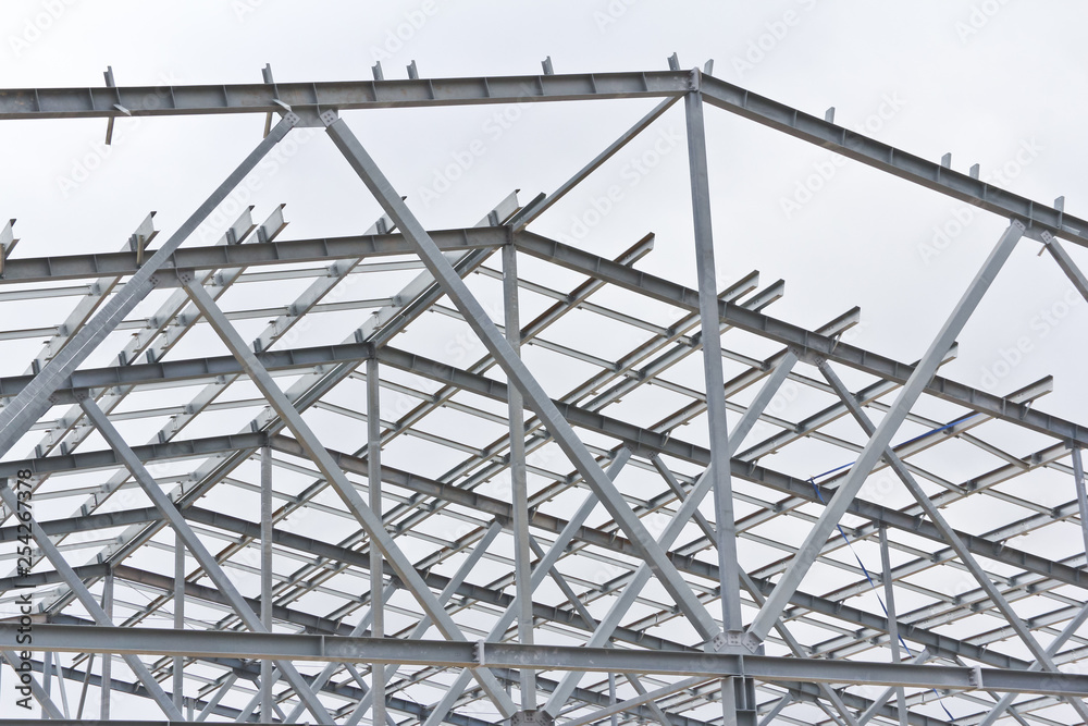Structure of building from galvanized metal. Steel construction on sky background. Metal galvanizing technology to prevent corrosion. Structure of building from galvanized metal. Steel construction on sky background. Metal galvanizing technology to prevent corrosion.