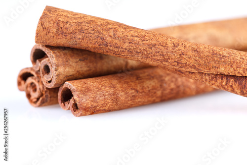 Fragrant cinnamon sticks isolated on white background.