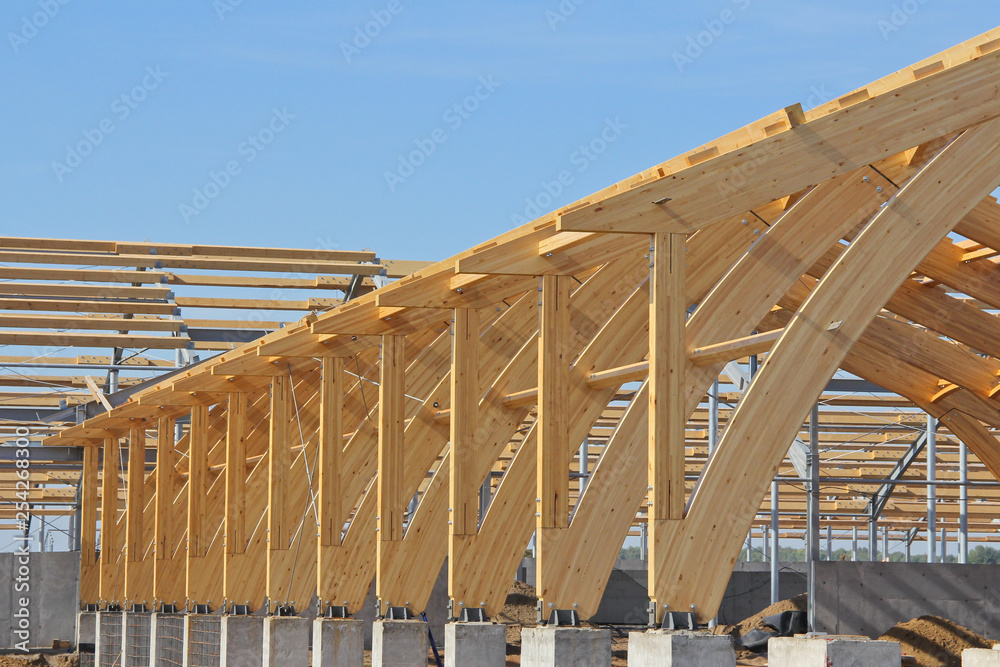 The frame of the building of laminated veneer lumber. Roof construction of  laminated veneer lumber. Building. Glued laminated timber. Stock Photo |  Adobe Stock