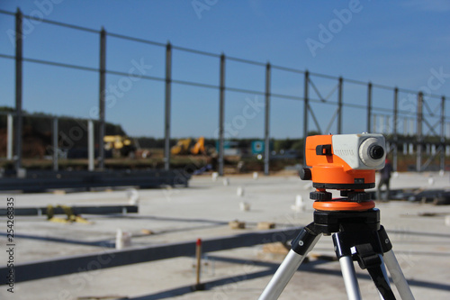 Theodolite at the construction site. Geodetic tool for measuring ground level.