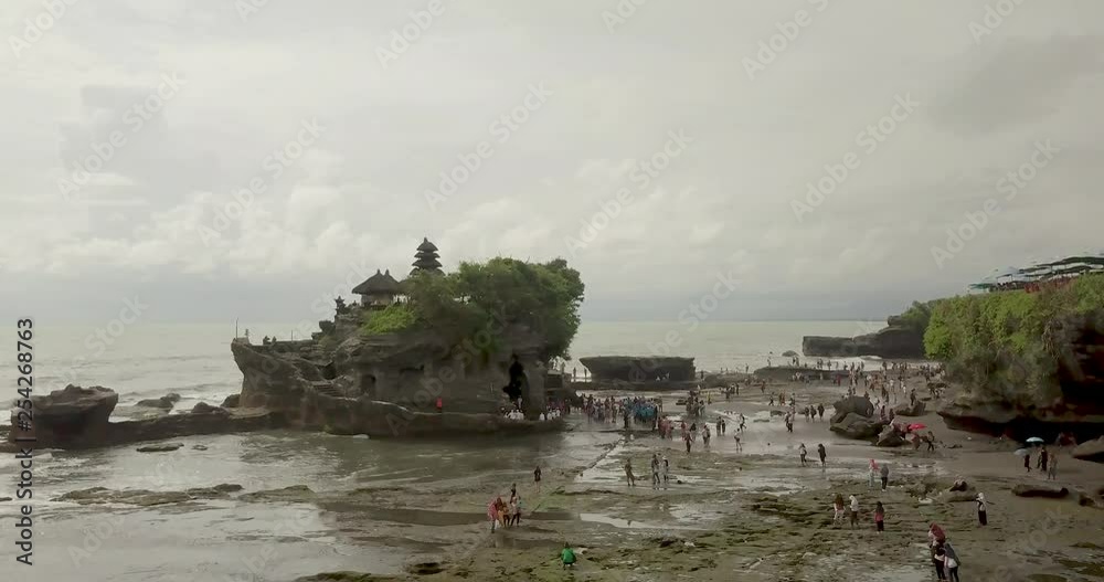 Breathtaking aerial view of Pura Tanah Lot. Tanah Lot is a rock formation off the Indonesian island of Bali. Breathtaking aerial view of Pura Tanah Lot. Tanah Lot is a rock formation off the Indonesian island of Bali.
