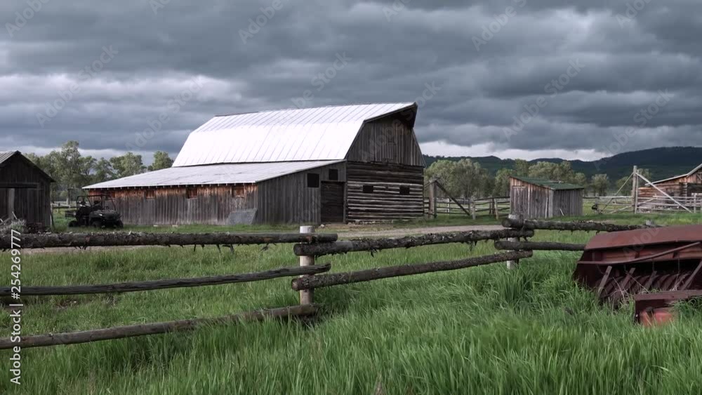 Antique farm in the storm at Moulton Barn on Mormon Row in Grand Teton National Park, Wyoming Antique farm in the storm at Moulton Barn on Mormon Row in Grand Teton National Park, Wyoming