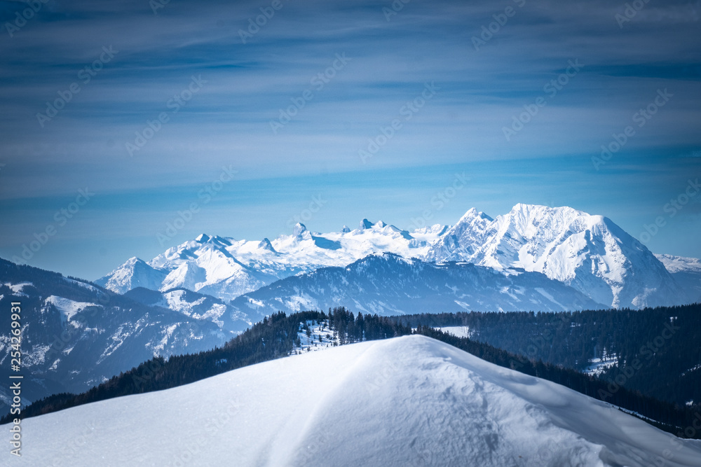 Naklejka premium View from snowy plateau Kaiserau to mountain Dachstein on winterday