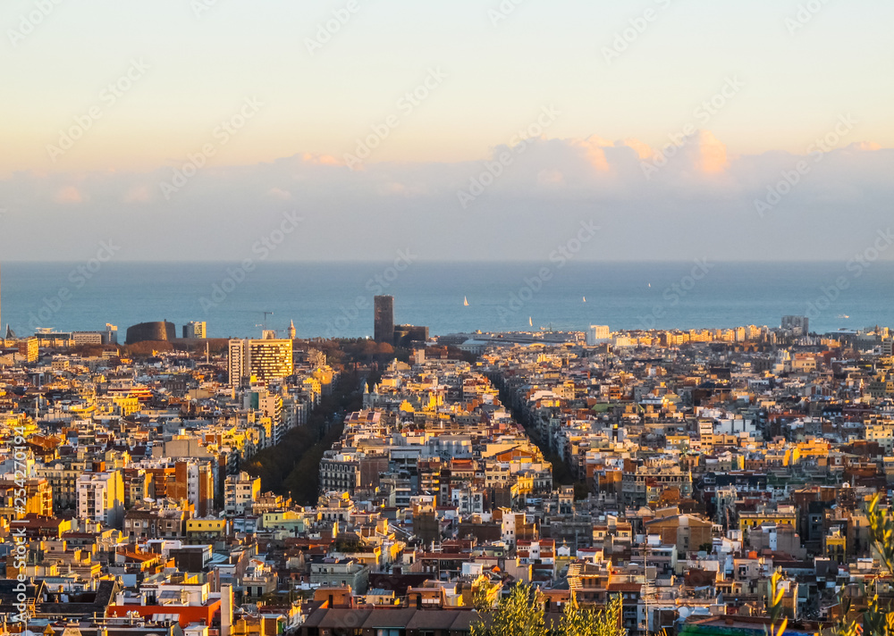 Aerial view of Barcelona city and mediterranean sea from Park Guell in sunset. Spain. November 2010