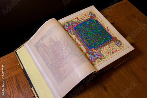 Glow illuminating the Holy Bible in the dark.