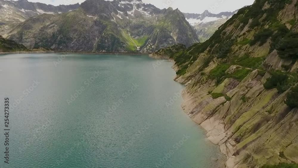mountain lake in the swiss alps, reservoir in the middle of the mountains mountain lake in the swiss alps, reservoir in the middle of the mountains