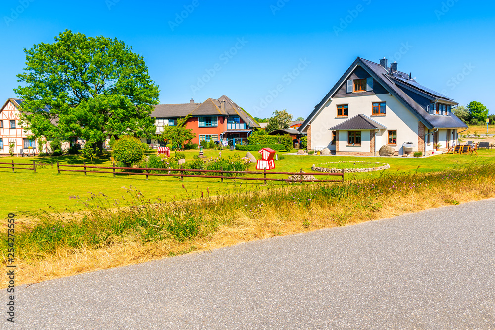 Cycling way and traditional house near Lobbe village, Ruegen island, Baltic Sea, Germany