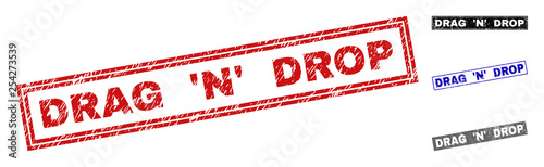 Grunge DRAG 'N' DROP rectangle stamp seals isolated on a white background. Rectangular seals with grunge texture in red, blue, black and grey colors.