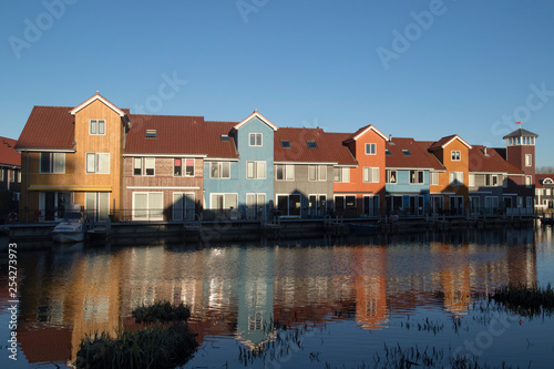 Famous Dutch cityscape, Reitdiephaven street with traditional colorful houses on water, Groningen, Netherlands, This buildings inspired by Scandinavian homes