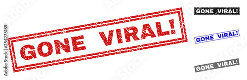 Grunge GONE VIRAL! rectangle stamp seals isolated on a white background. Rectangular seals with grunge texture in red, blue, black and gray colors.