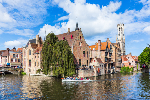 Bruges, Belgium. The Rozenhoedkaai canal in Bruges with the Belfry in the background.