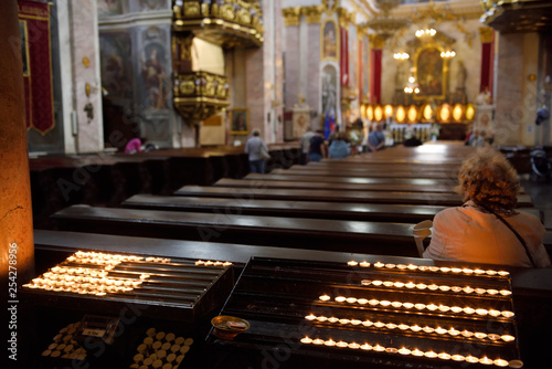 Interior of the St. Nicholas Ljubljana Cathedral Catholic church with votive candles at the back of the church pews Ljubljana Slovenia © Reimar