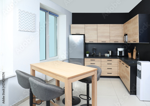 Cozy modern kitchen interior with new furniture and appliances © New Africa