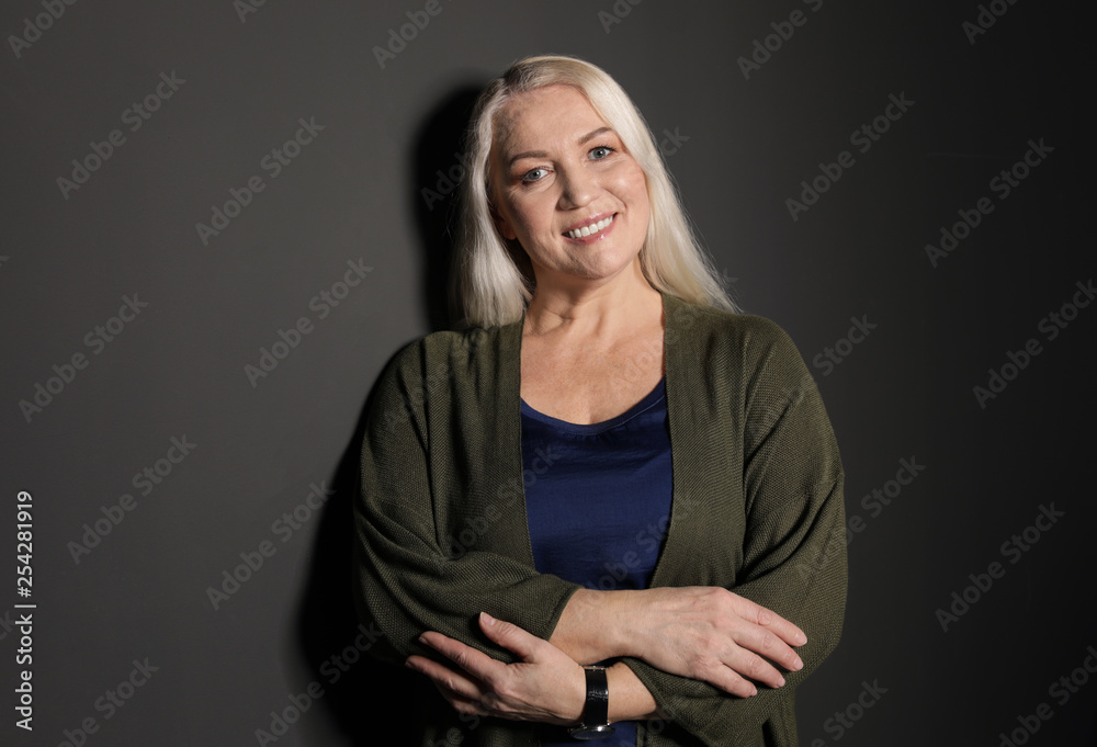 Portrait of mature woman on black background Portrait of mature woman on black background
