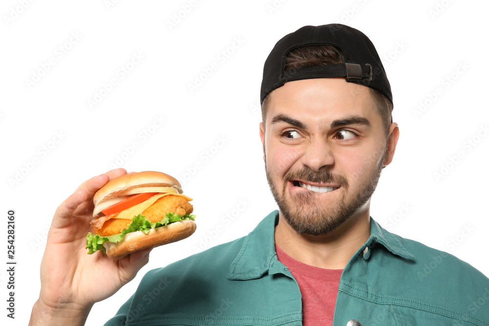 Handsome man with tasty burger isolated on white Handsome man with tasty burger isolated on white