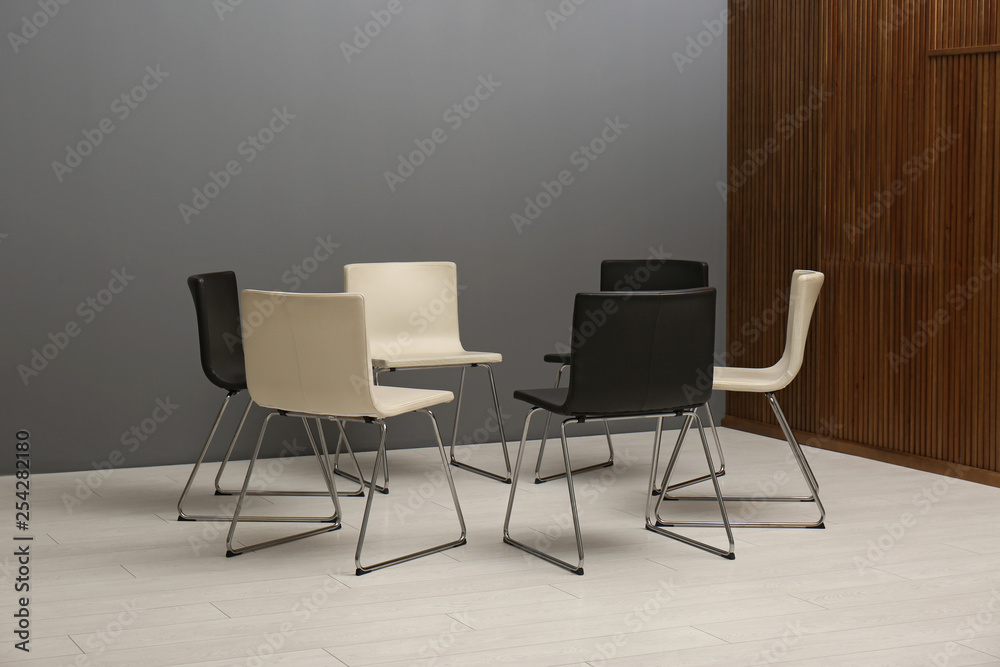 Chairs prepared for group therapy session in office. Meeting room interior Chairs prepared for group therapy session in office. Meeting room interior