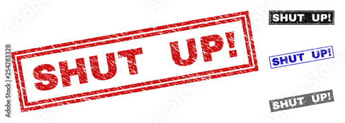 Grunge SHUT UP! rectangle stamp seals isolated on a white background. Rectangular seals with grunge texture in red, blue, black and gray colors.