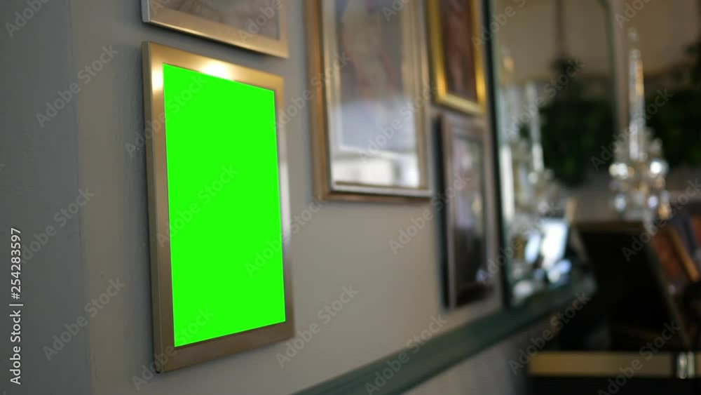 Golden green screen picture frame in modern hallway