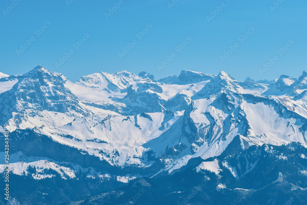 Beautiful panoramic view of snow-capped mountains in the Swiss Alps. Beautiful panoramic view of snow-capped mountains in the Swiss Alps.