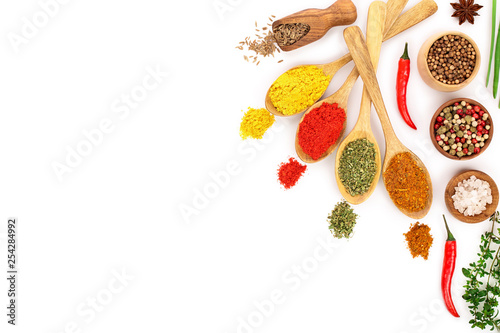Fototapeta Naklejka Na Ścianę i Meble -  mix of spices in wooden spoon isolated on a white background with copy space for your text. Top view. Flat lay. Set or collection