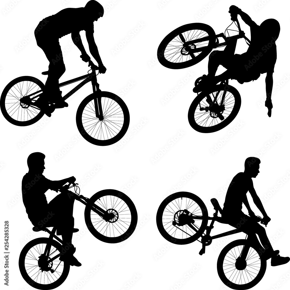 Obraz premium silhouette of male doing bike trick