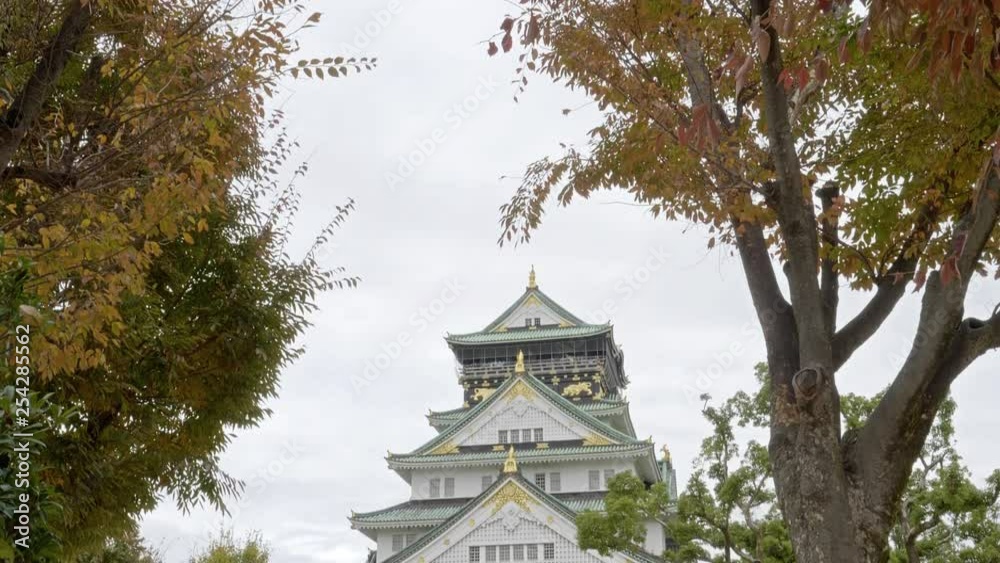 Osaka castle, tilt reveal shot, Autumn colors in city park. Osaka castle, tilt reveal shot, Autumn colors in city park.