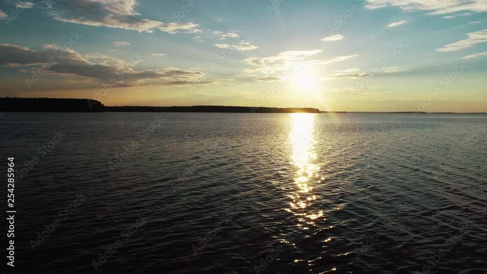 Aerial view. Amazing sky reflected in water. Beautiful sunset over the lake. Aerial view. Amazing sky reflected in water. Beautiful sunset over the lake.
