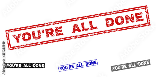 Grunge YOU'RE ALL DONE rectangle stamp seals isolated on a white background. Rectangular seals with distress texture in red, blue, black and grey colors.