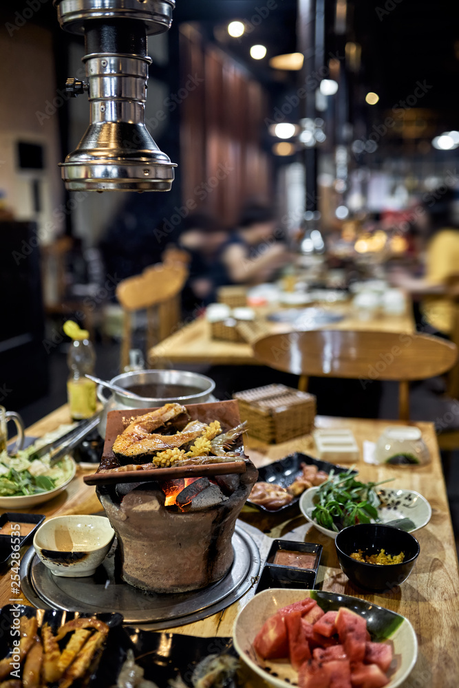 Fototapeta premium Traditional vietnamese hot spot restaurant with varied food