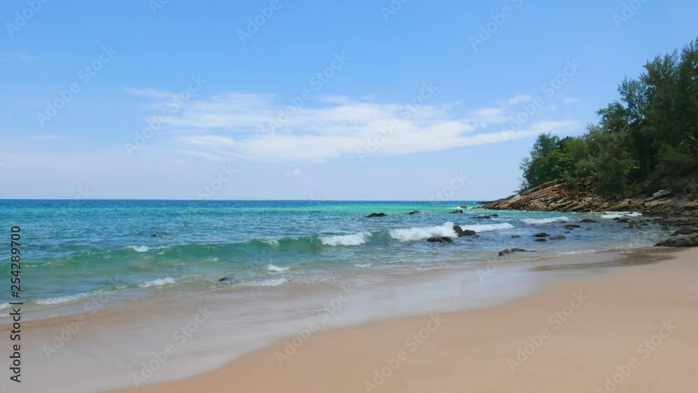 Relaxing on a serene calm beach, with ocean waves hitting the shoreline
(wide shot) Relaxing on a serene calm beach, with ocean waves hitting the shoreline
(wide shot)