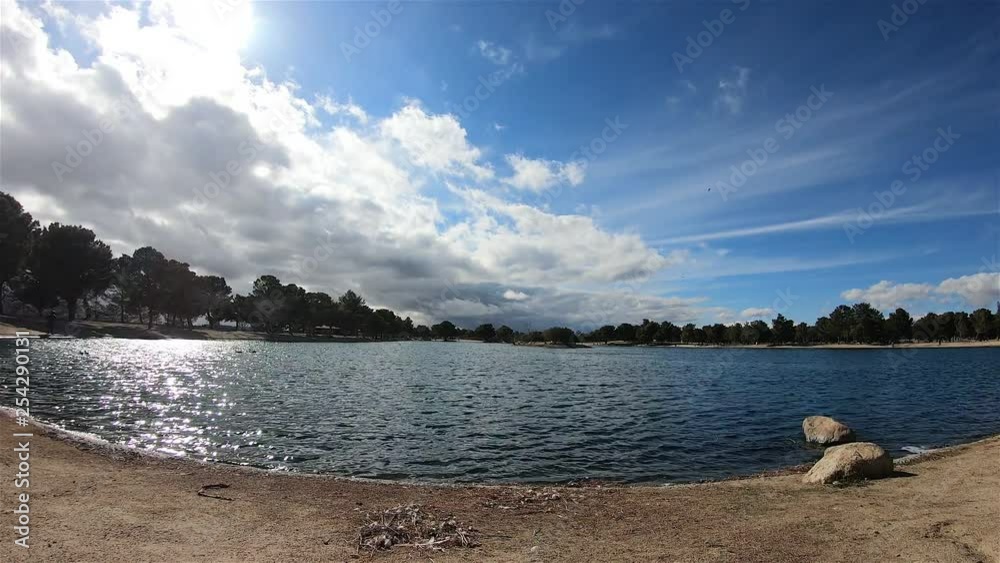 Time lapse of clouds traveling over a lake at Apollo Community Regional Park in Lancaster, California Time lapse of clouds traveling over a lake at Apollo Community Regional Park in Lancaster, California