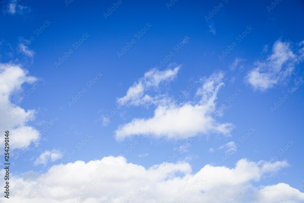 Beautiful white clouds on a sky background. Blue sky with puffy clouds Beautiful white clouds on a sky background. Blue sky with puffy clouds
