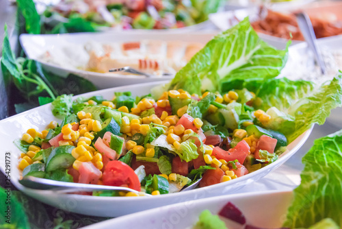 Assortment of fresh vegetable salads in restaurant buffet
