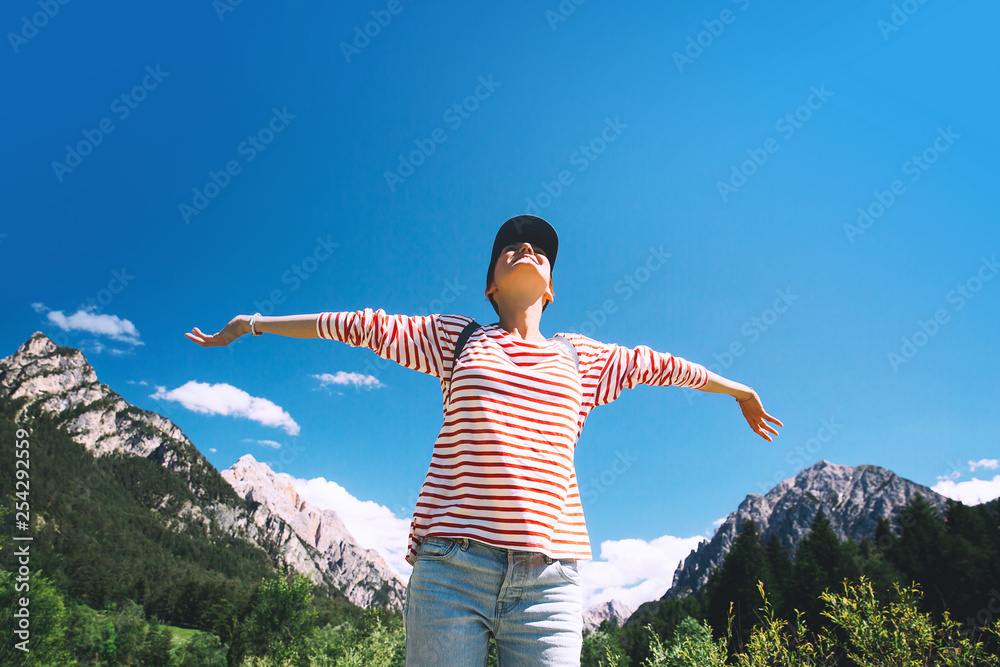 Woman with raised arms up on nature in Dolomites, South Tyrol, Italy, Europe. Woman with raised arms up on nature in Dolomites, South Tyrol, Italy, Europe.