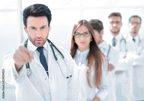 strict doctor  pointing at you  standing in the workplace