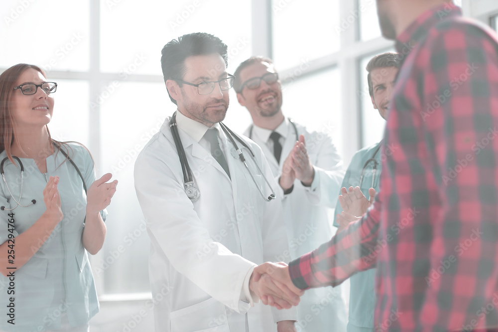 Thankful patient shaking doctors hand Thankful patient shaking doctors hand