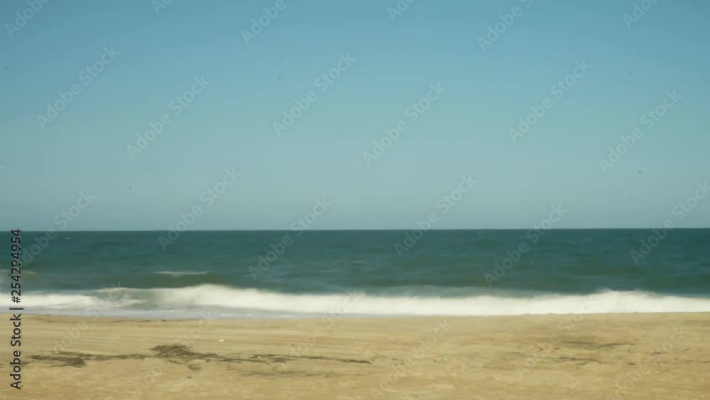 Panning time-lapse shot of the Atlantic Ocean and beach in Delaware, USA with optical flow effect. Panning time-lapse shot of the Atlantic Ocean and beach in Delaware, USA with optical flow effect.