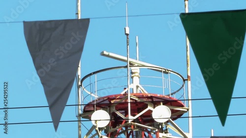 Spinning Marine Radar with Feast Flag Banner In the Background photo