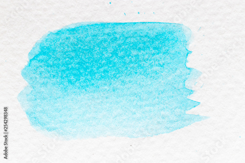 Cyan or light blue color watercolor handdrawing as brush or banner on white paper background