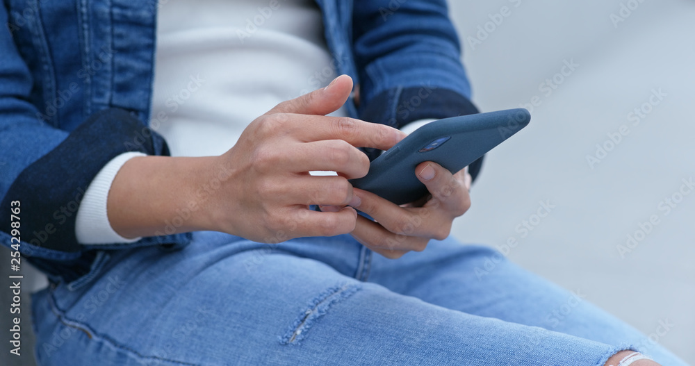 Woman work on smart phone at outdoor