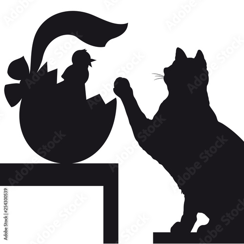 Sagoma nera di gatto con uovo di Pasqua e pulcino