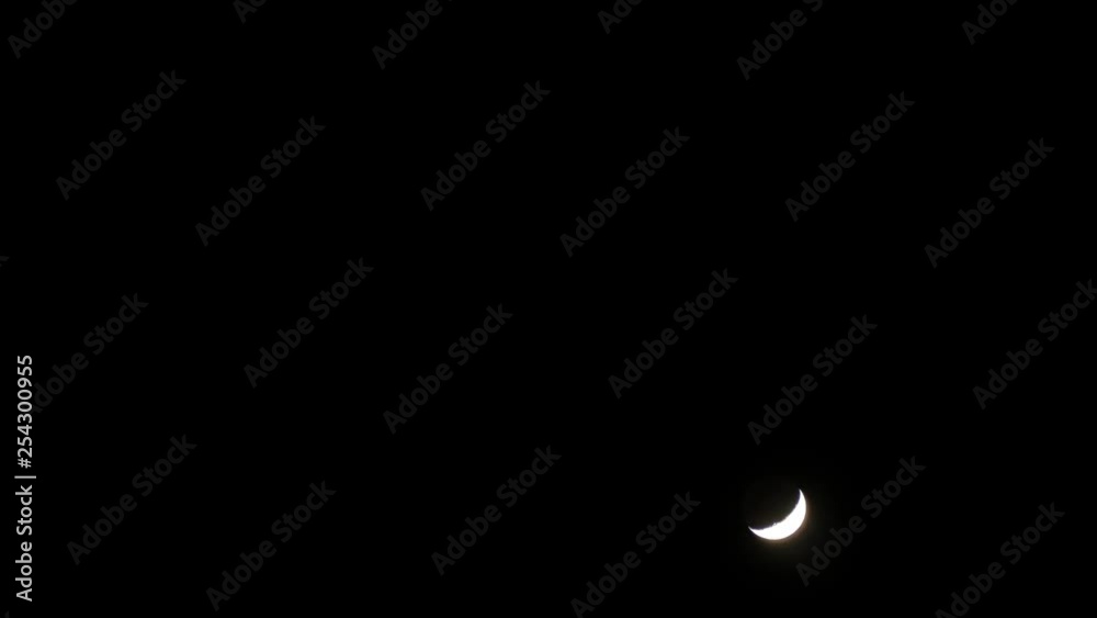 time lapse of a crescent moon at night in winter time lapse of a crescent moon at night in winter