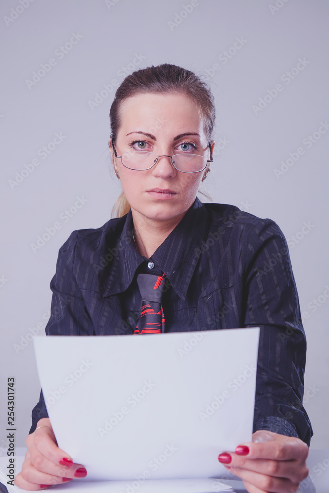 Portrait of young attractive female recruiter holding paper and waiting for job interview. Portrait of young attractive female recruiter holding paper and waiting for job interview.
