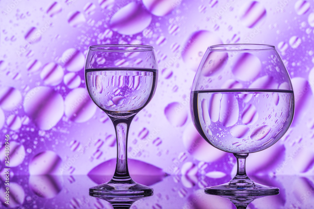 two glasses on a color abstract background two glasses on a color abstract background