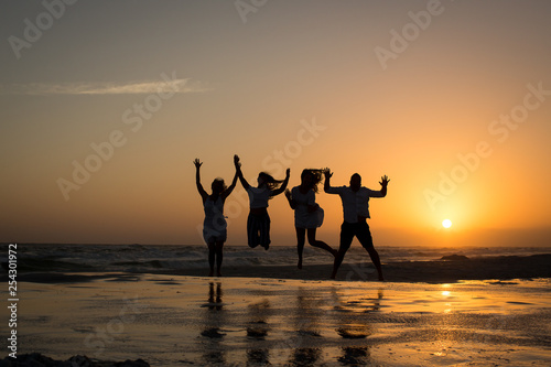 silhouette of family on the beach